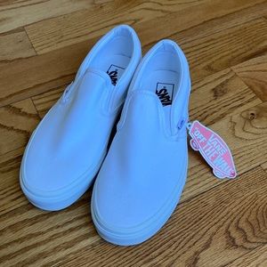 Brand New With Tags Vans white canvas slip on shoes.